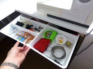 Pull-out drawer directly underneath my sewing machine so all my essentials are accessed quickly and easily.