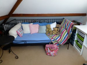 A comfortable day-bed on which I curl up and do a spot of crochet or hand-stitching.