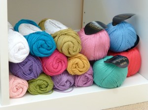 Yarn stacked in open shelves.