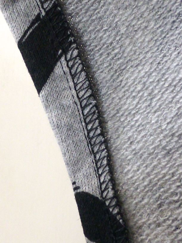 poncho overlocked edges